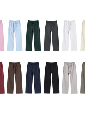 Relaxed fit lounge trousers in multiple solid colors with drawstring waistbands.