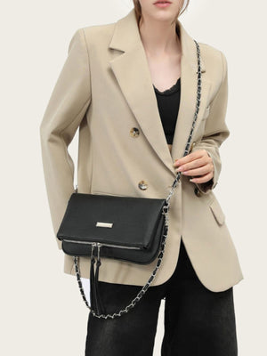 shoulder bag in black featuring chain strap and rectangular fit