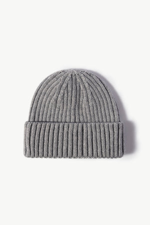 Gray chunky ribbed knit beanie with a folded cuff.