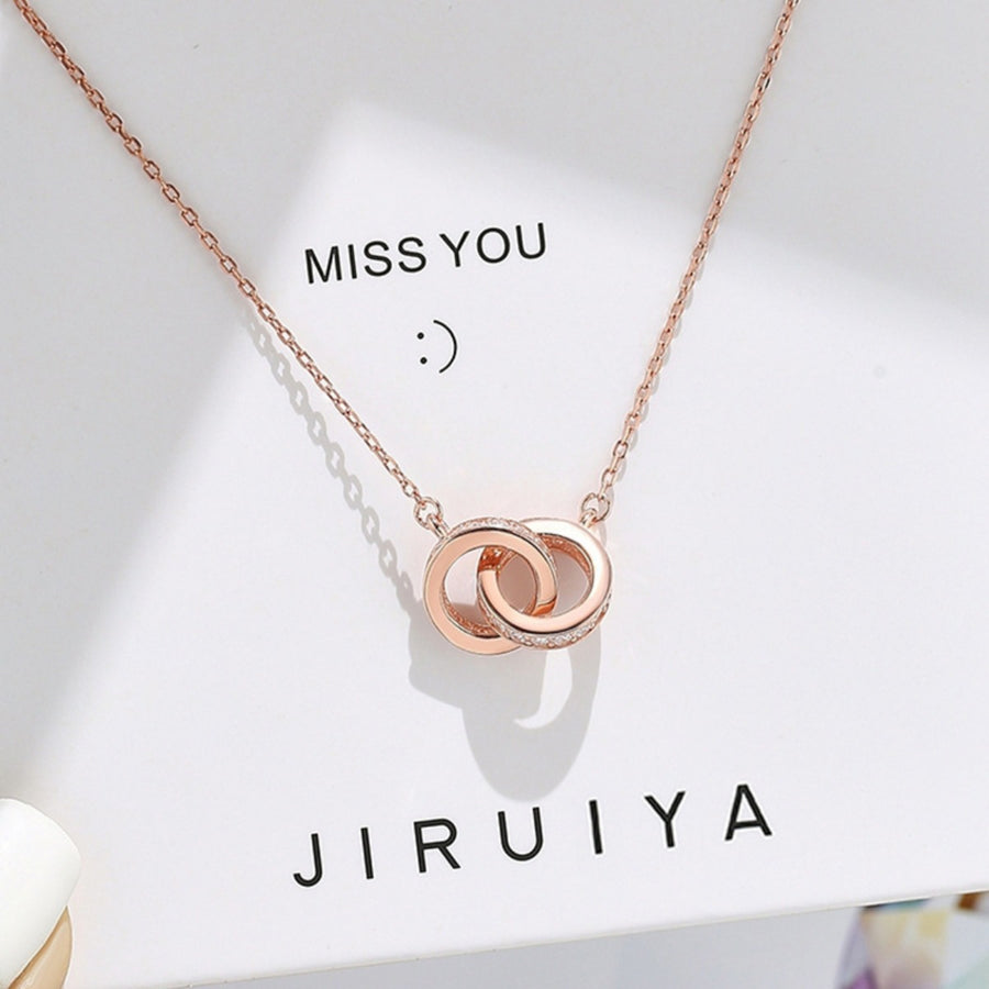 Rose gold double circle pendant necklace with pave crystal accents