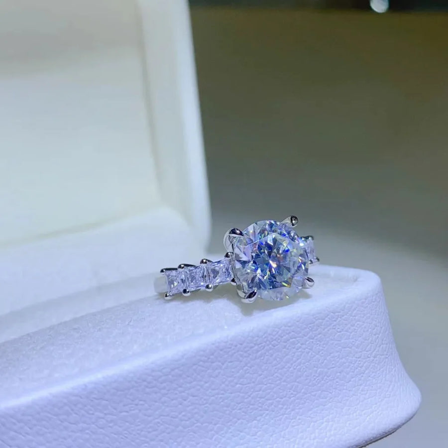 Radiant round moissanite and baguette ring in silver sterling silver.