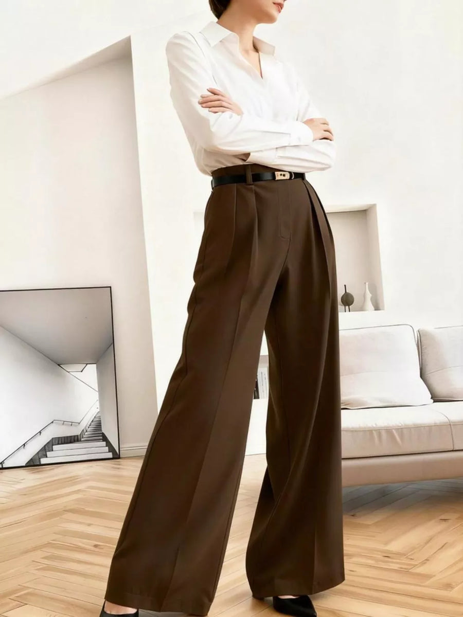 Brown high-waisted pleated wide leg maternity trousers with a relaxed fit.