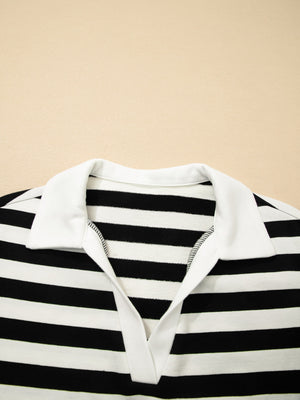 Black and white striped cotton blouse with a white collar and v-neck detail.