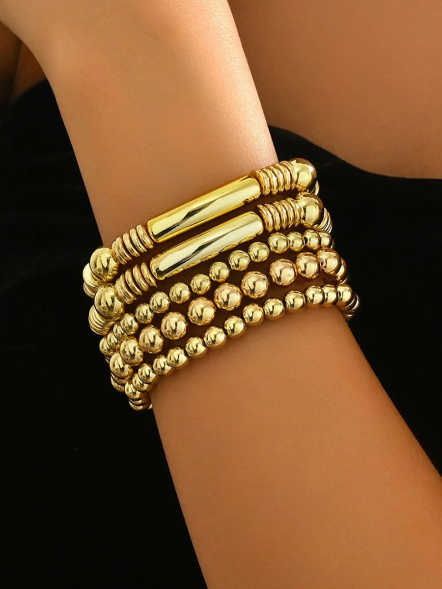bracelet in gold featuring beaded and fitted fit