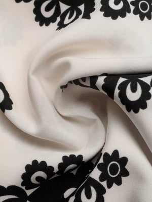 Loungewear shorts in ivory with a black medallion print and smocked waist detail.