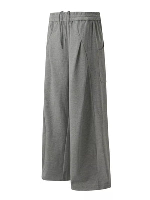 95%polyester, 5%spandex Care instructions: Machine wash cold sweatpants in Black with wide-leg silhouette