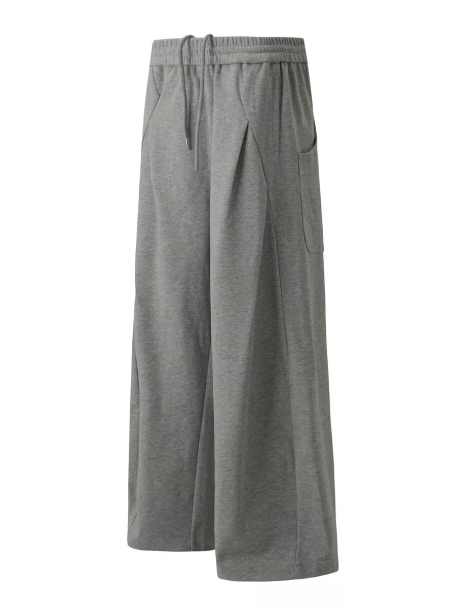 95%polyester, 5%spandex Care instructions: Machine wash cold sweatpants in Black with wide-leg silhouette