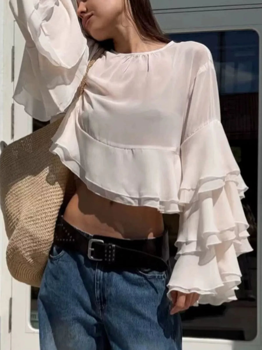 100% polyester Care instructions: Machine wash cold blouse in ivory with relaxed silhouette