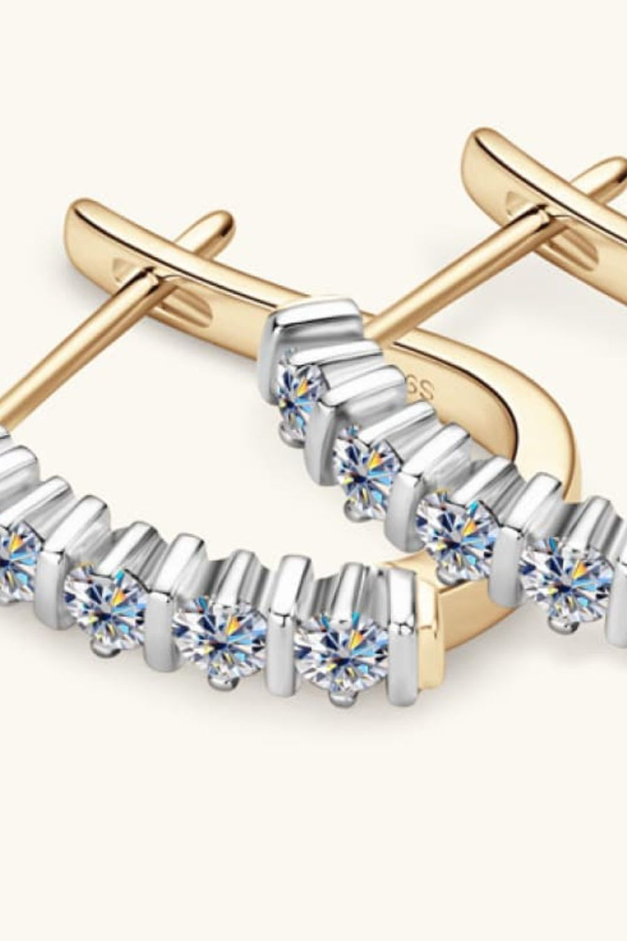 Silver pavé hoop earrings with moissanite and gold plating.