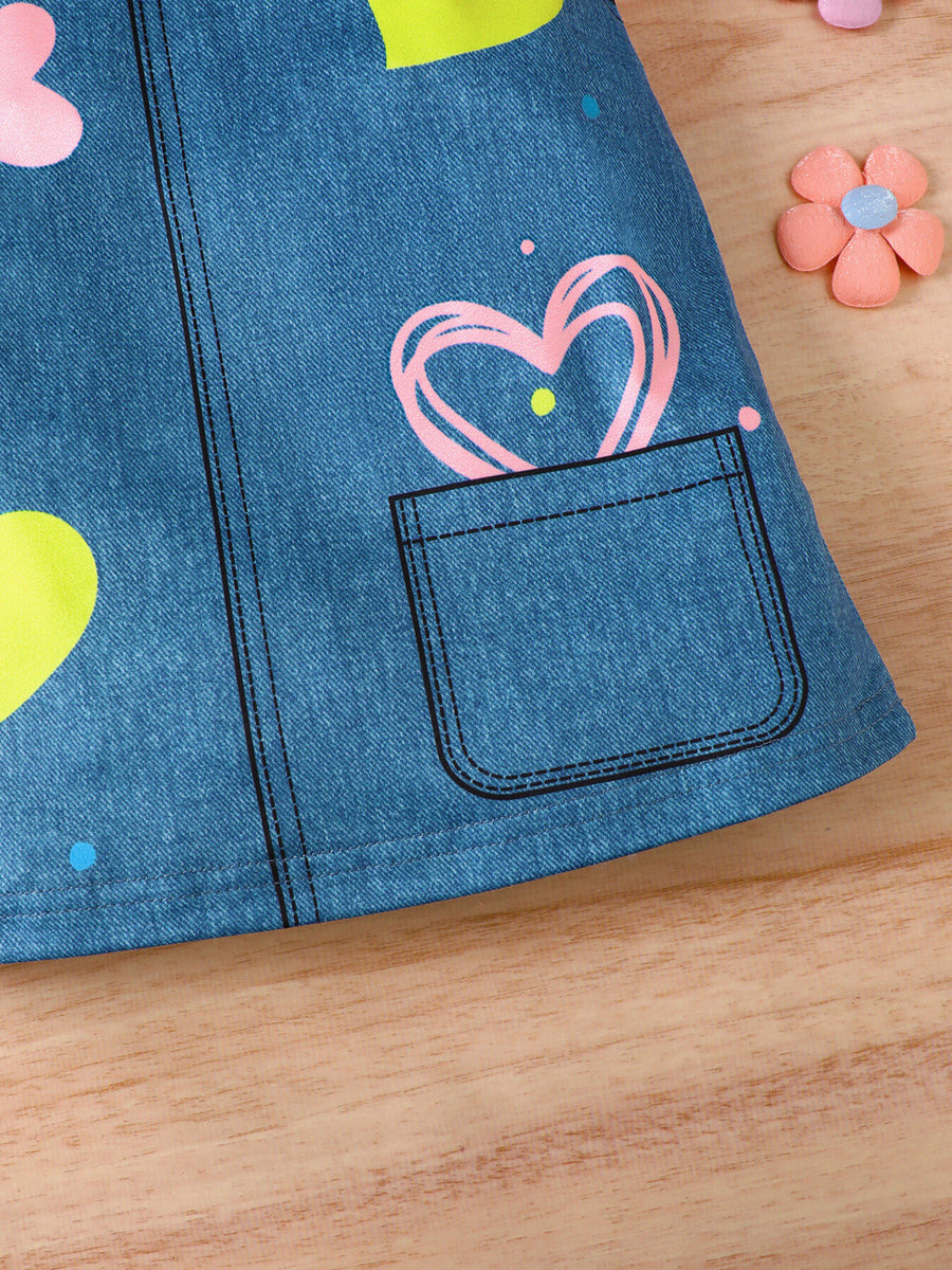 Baby dress with blue denim print, pink and yellow hearts, and a functional pocket.