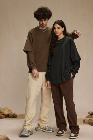Brown and dark green layered long sleeve tops with crew necks