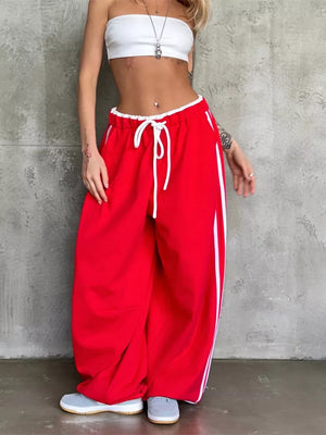 sweatpants in red featuring drawstring and wide-leg fit