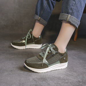 Khaki rhinestone embellished lace-up sneakers with a chunky sole and side zipper detail.