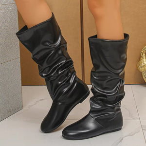 boots in black featuring slouchy shaft and slouchy fit