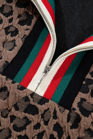 Brown leopard jacquard half-zip shirt with red, green, and black striped trim.