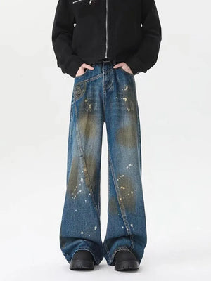 Men's plus-size wide-leg jeans in washed blue denim with paint splatter details.