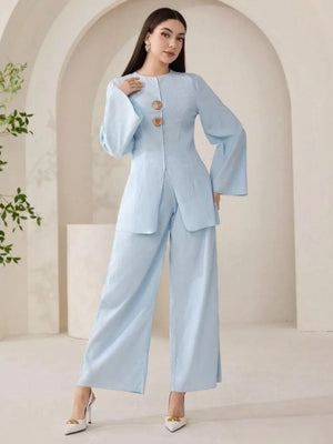 Light blue crinkled texture two-piece set with shell buttons and wide-leg pants.