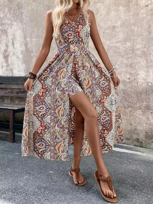Maternity swim dress in multicolor paisley print with a cinched waist and dramatic slit.