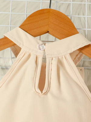 Beige toddler set with keyhole neckline and pearl bowknot detail