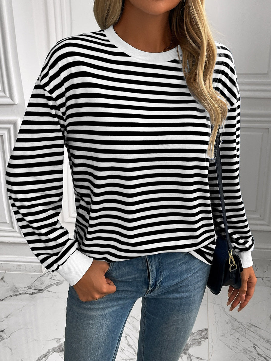 Horizontal stripe crewneck sweatshirt with white cuffs and crewneck.
