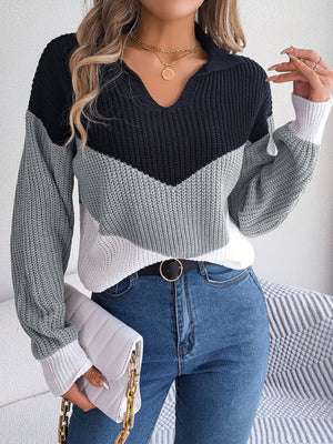Chevron block knit polo sweater in black, gray, and white acrylic with a V-neck.