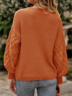 Terracotta pullover sweater featuring ribbed knit and textured