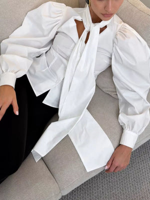 White blouse with waist-length and button-front