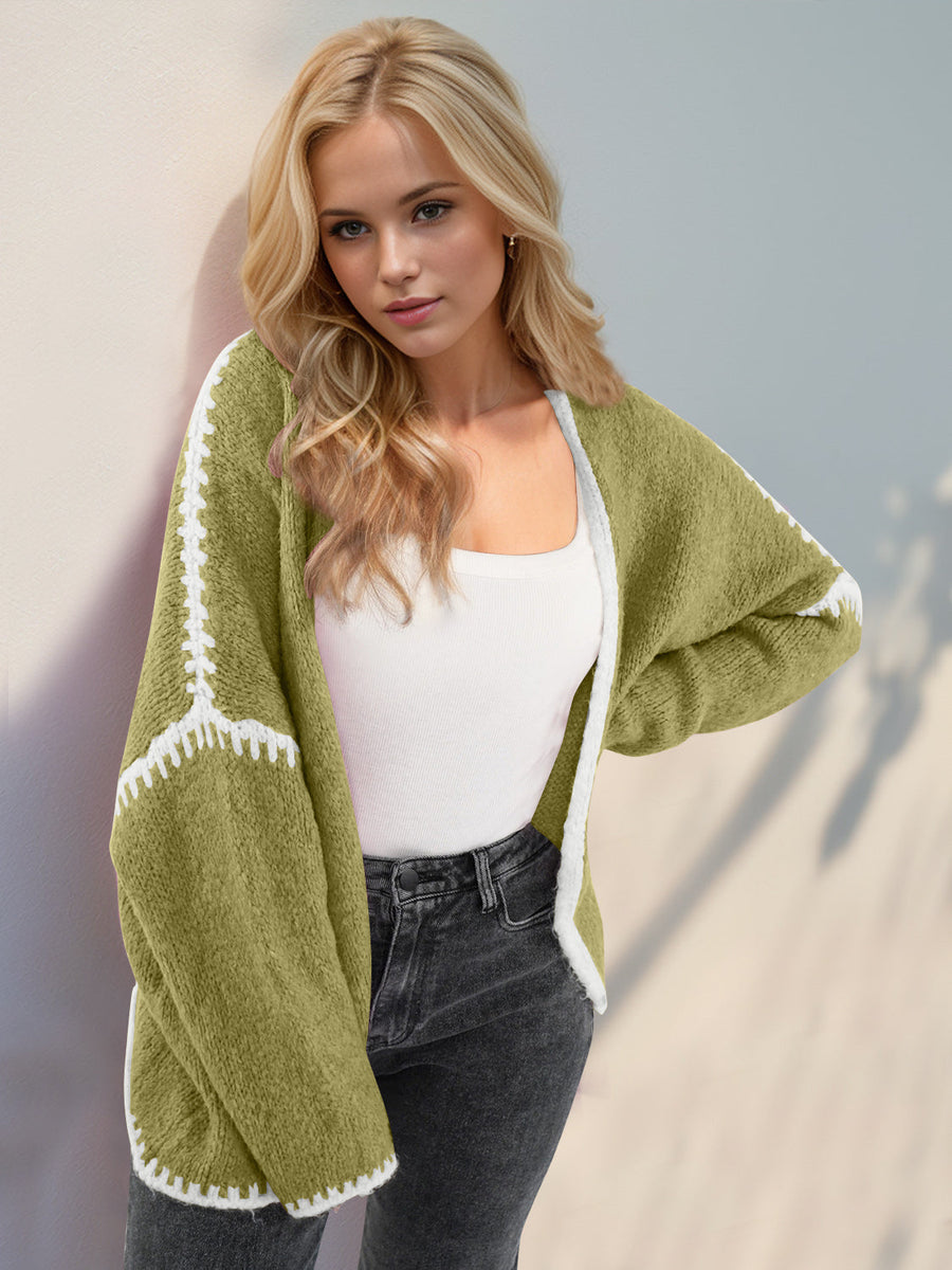Oversized knit cardigan in Yellow-Green with white contrast stitching detail on sleeves and hem.