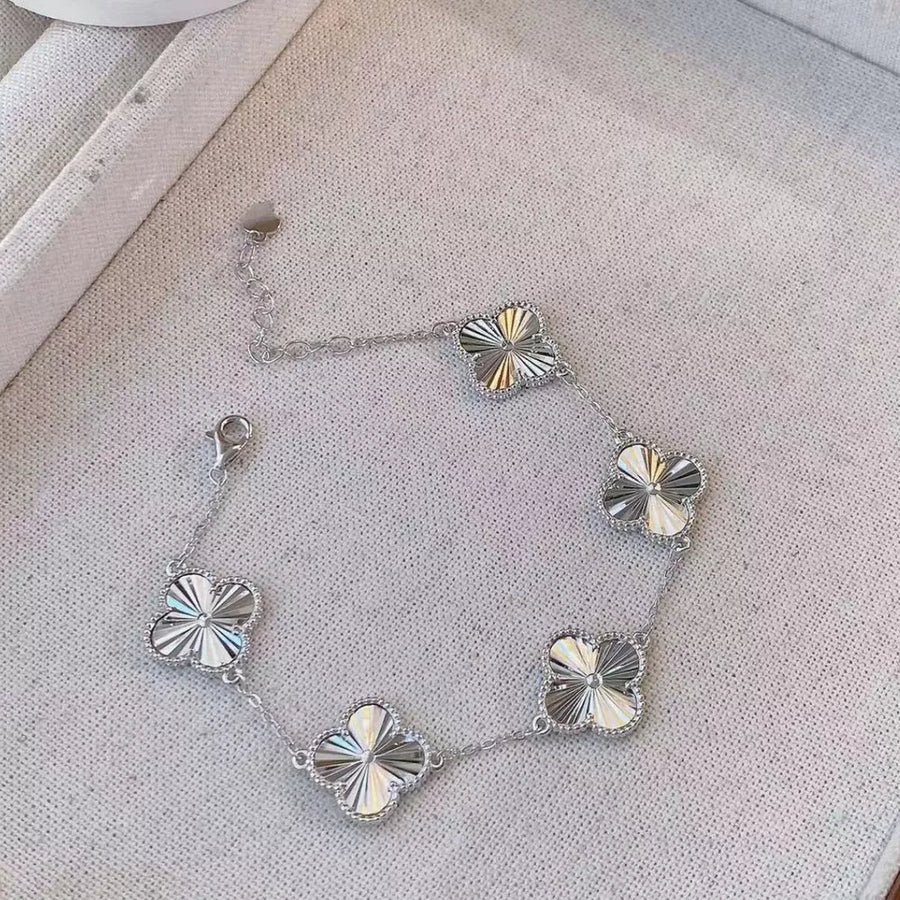bracelet featuring four-leaf clover in Silver with 925 sterling silver Care instructions: Avoid wearing during exercise, as