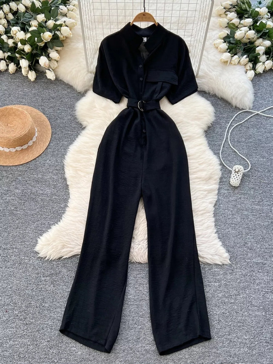 Black belted wide leg romper with short sleeves and button-down front