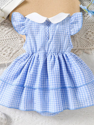 Pastel blue gingham baby dress with white collar and flutter sleeves.