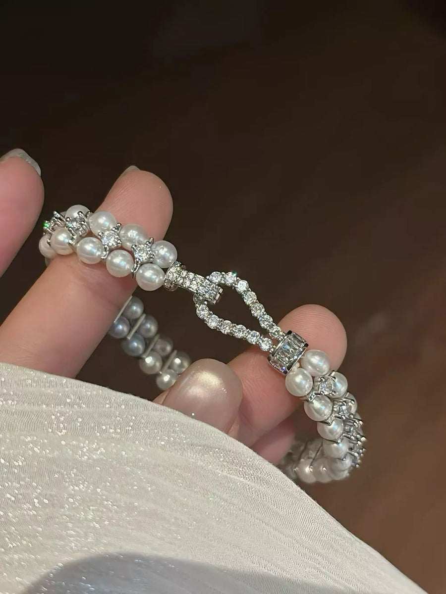 Synthetic Pearl,Alloy,Zircon Care instructions: Avoid wearing during exercise, a bracelet in silver with fitted silhouette