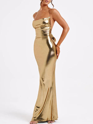 Gold backless ruched maxi dress with halter neckline and tie detail
