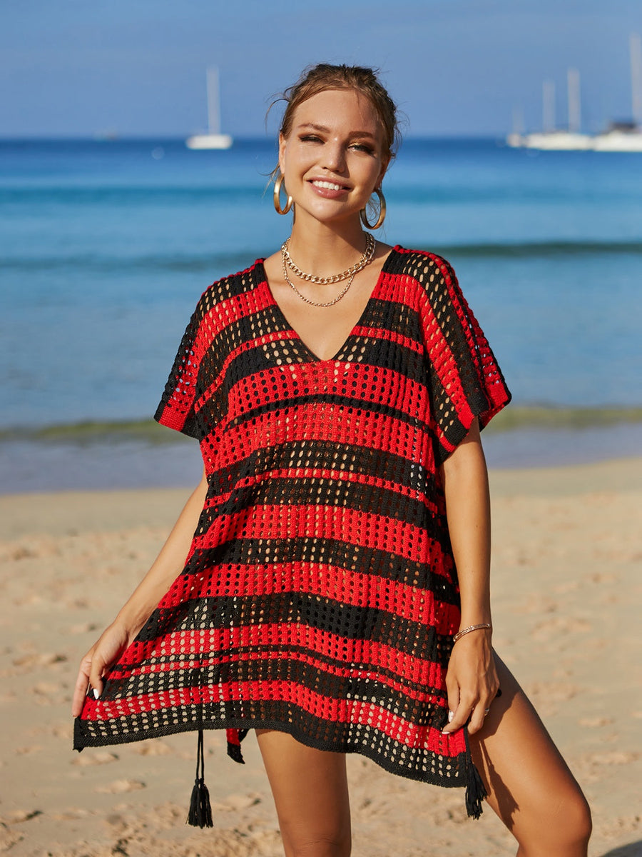 Red and black striped crochet beach cover-up with drawstring and tassels.