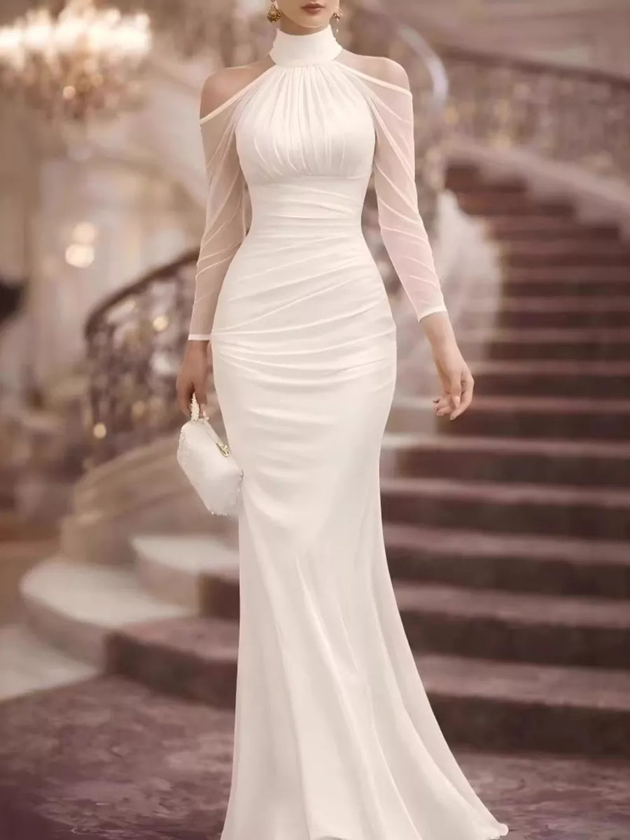 White cold shoulder maxi dress with ruched bodice and sheer sleeves.