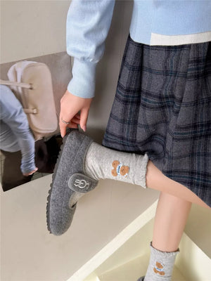 brown socks featuring ruffled cuff and motif