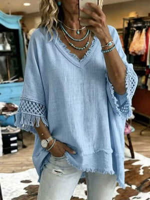 blouse in sky blue featuring fringe trim and loose fit