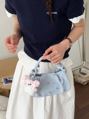 pink crossbody bag featuring ruched and ditsy floral