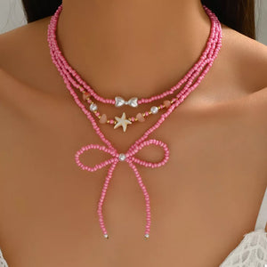18K Gold-Plated, Alloy, Resin, Millet Pearl Care instructions: Avoid wearing dur necklace in Fuchsia Pink with layered