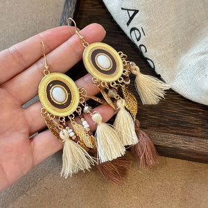 Feathered cascade enamel drop earrings with tassels in blue and brown.