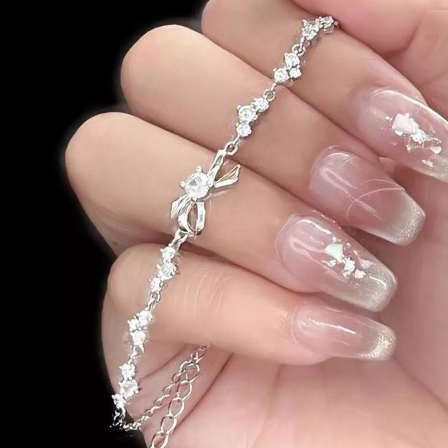 Silver with bracelet with bow detail 8