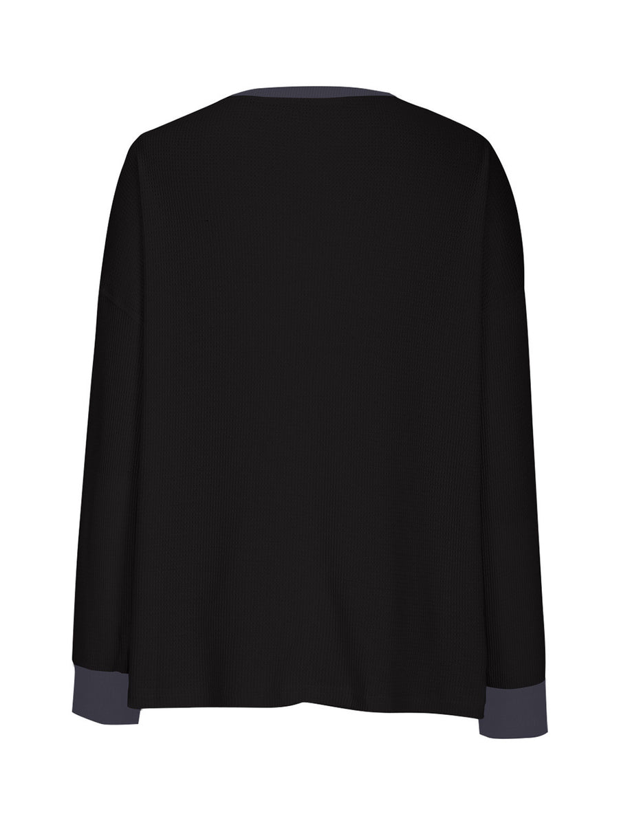 Black waffle knit raglan sleeve sweatshirt with contrasting gray cuffs and neckline.