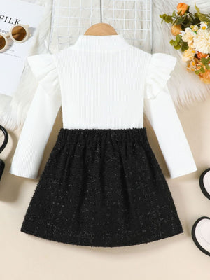White ruffle sleeve turtleneck top with black tweed skirt set