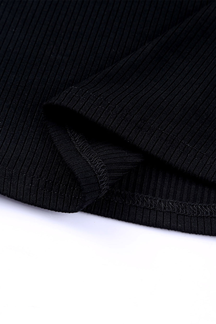 Black ribbed knit blouse with dot mesh sleeves detail