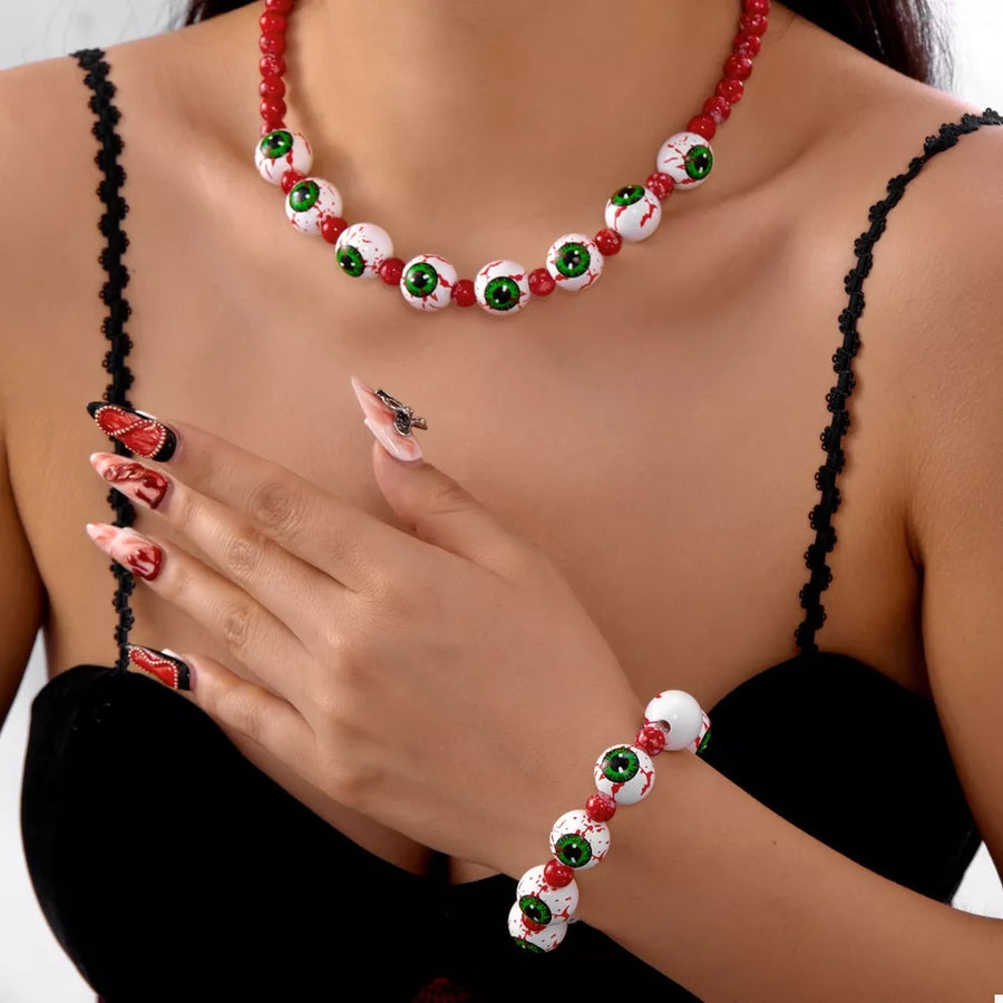 white jewelry set with eyeball and round neck
