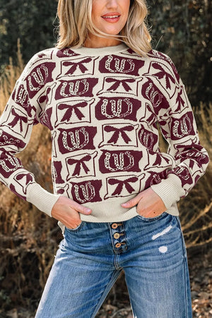 ivory pullover sweater with bow and horseshoe motif and crew neck