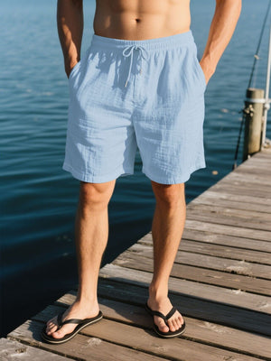 Light blue linen shorts with drawstring waist and pockets