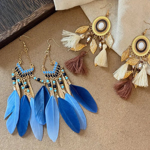 Blue feathered cascade & enamel drop earrings with gold leaf and bead accents.