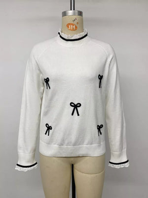 pullover sweater featuring bow motif in black with 50% viscose, 25% polyamide, 25% polyester Care instructions: Machine wash