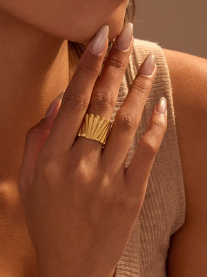 ring in gold featuring wide band and straight fit